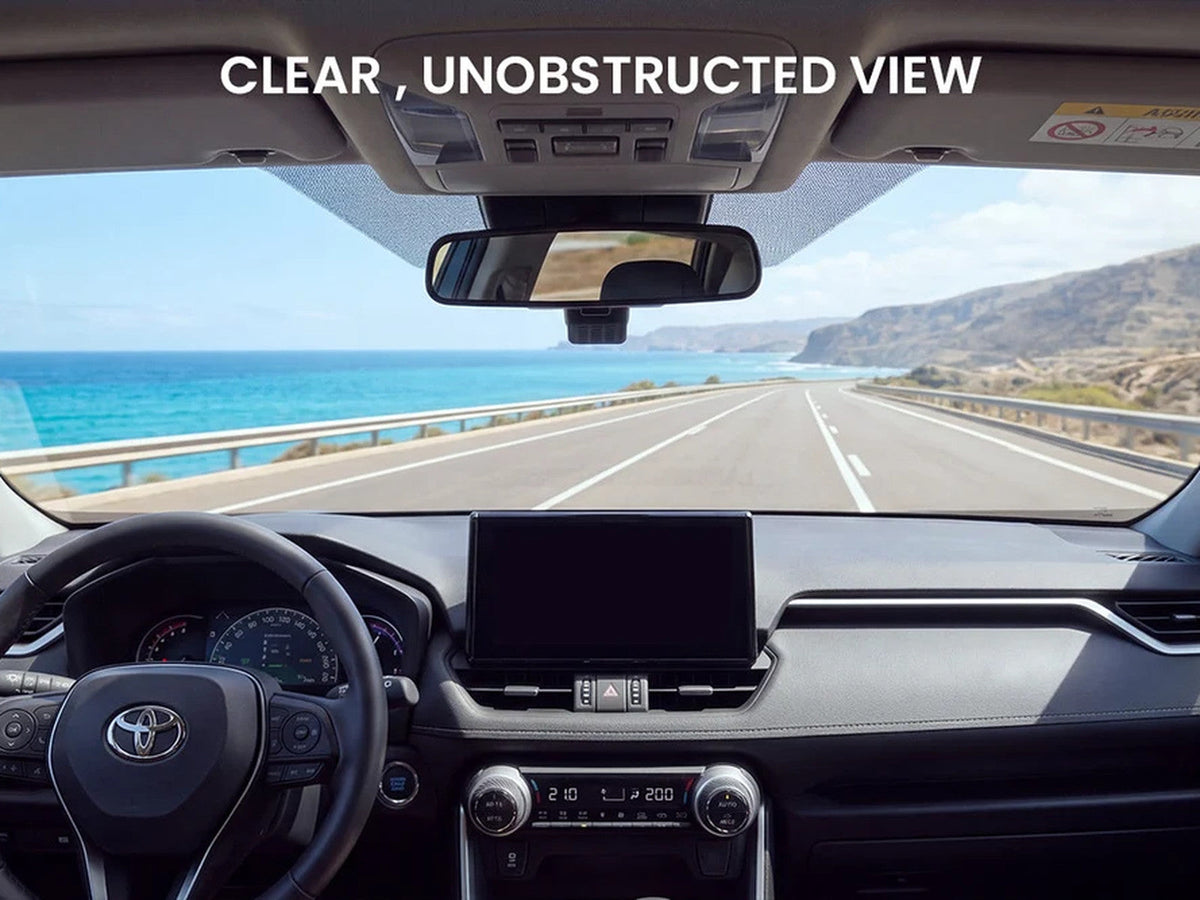 Toyota RAV4 dashboard and unobstructed windshield view on a coastal road